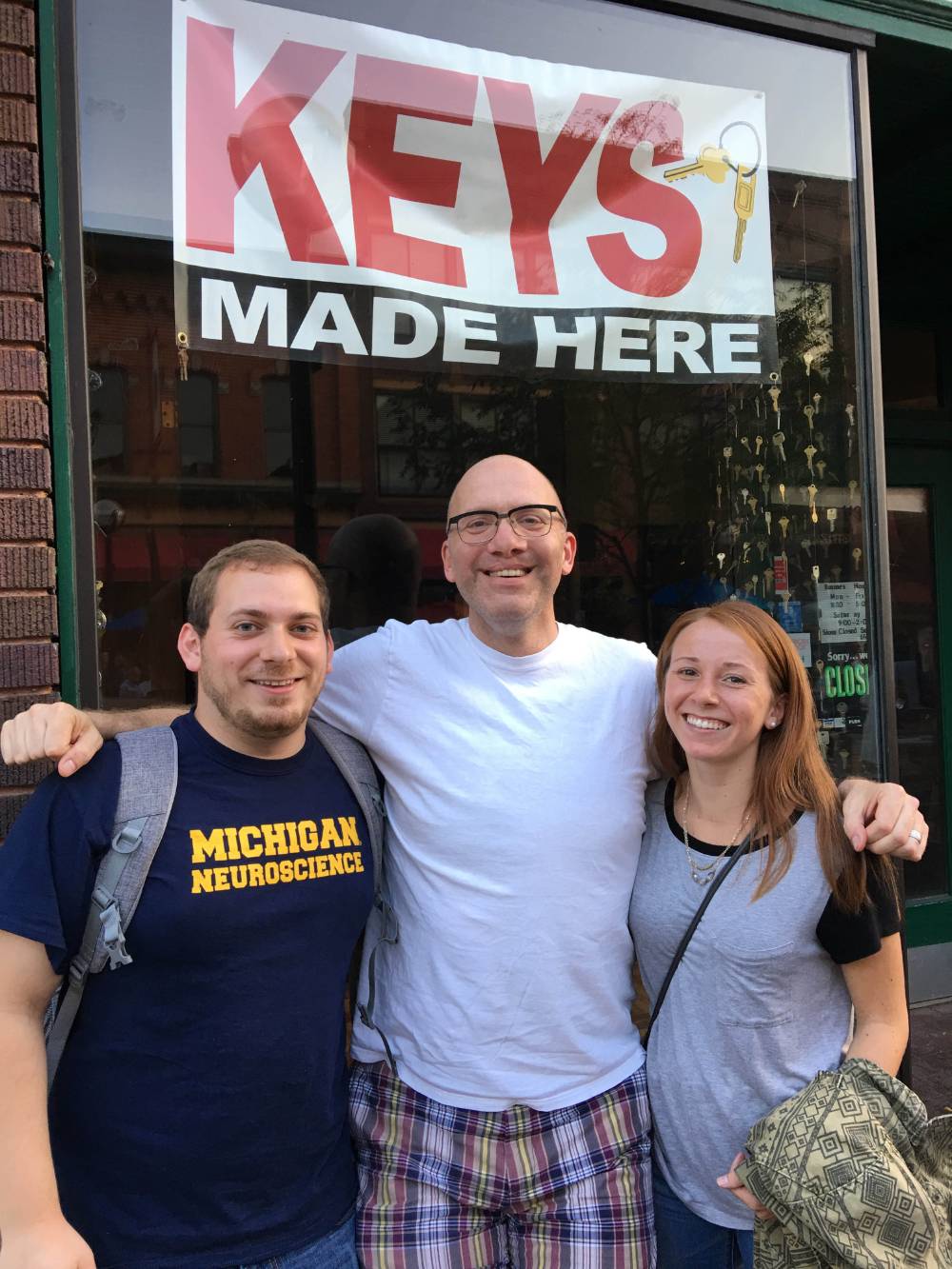 Dan, Merritt, and Jenna outrside a Key store